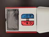 Nintendo Switch 32 Go Console Portable avec Manettes Joy-Con Bleu Néon/Rouge.